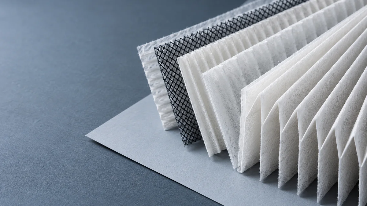 Decorative close-up of pleated filter media and mesh; not a fit guide